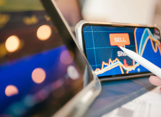 Trader analyzing forex options along with Bitcoin and Ethereum across multiple markets
